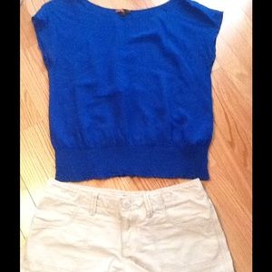 Blue sheer top and kaki shorts