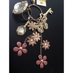 Gold necklace with detachable charm and ring