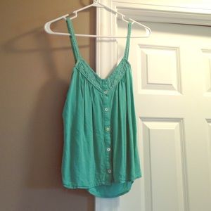 Mint colored tank top, with button on straps