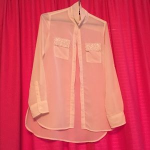 Cream with sparkly pockets top