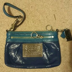 Blue shiny coach clutch