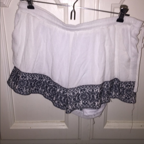WHITE shorts with embroidered blue design