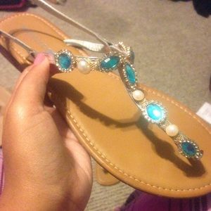 Sandals with blue, gold and pearl rhinestones.