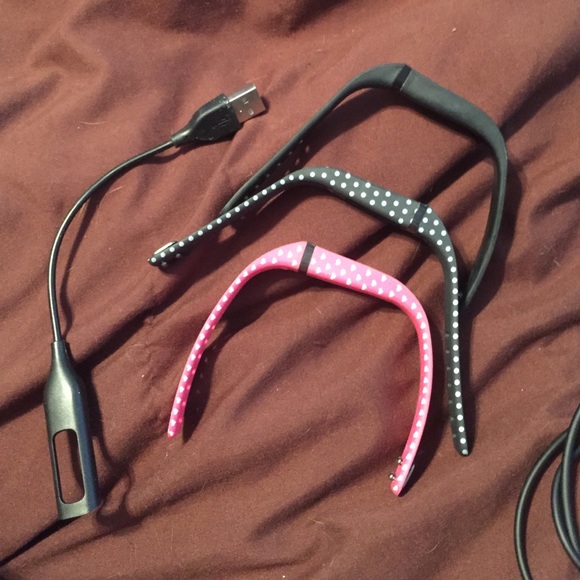 Fitbit, three bands and two chargers