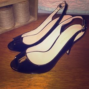 Black patent leather sling back pumps