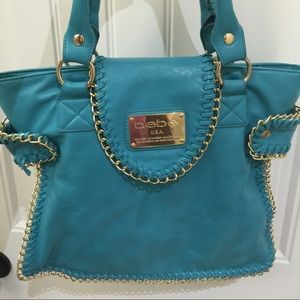 Bebe Aqua color purse slightly used