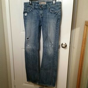 Faded light denim with tiny fashion tears