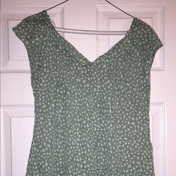 Green blouse with white accents
