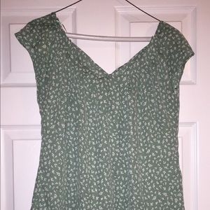 Green blouse with white accents