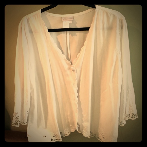 Flowy white blouse with lace sleeves and trim