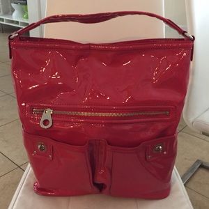Red patent leather handbag