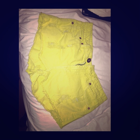 Yellow ripped high waisted shorts