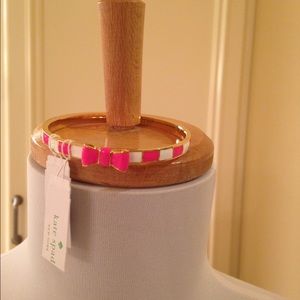Kate Spade gold and pink enameled bangle.
