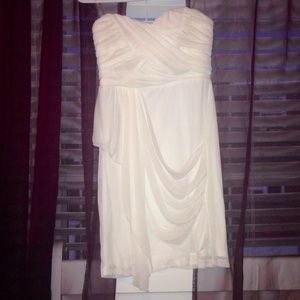 Short white chiffon draped bridesmaid dress.
