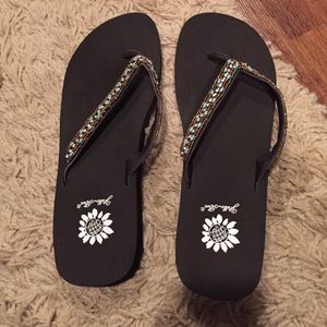 Yellow box brown flip flops