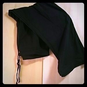 Black gym pants with blue accent strip