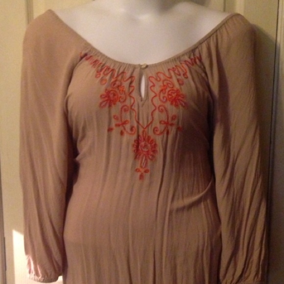 Tan tunic with red designs