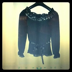 Black silk blouse. Very nice and and chic.