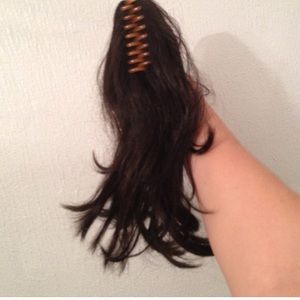 Hair piece with clip attached.