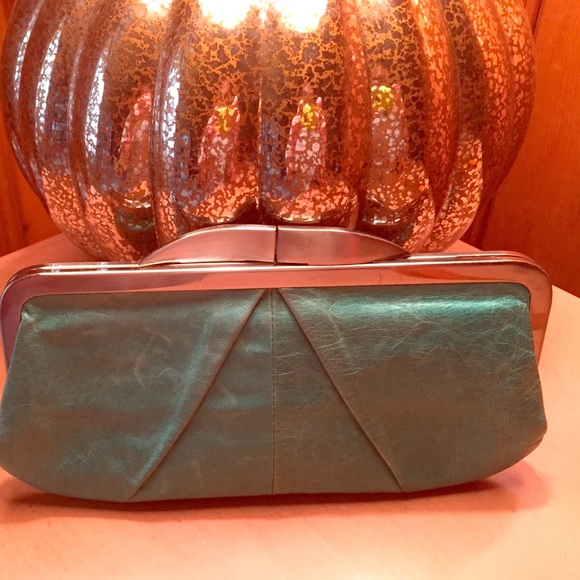Edgy, aqua clutch by Hobo.