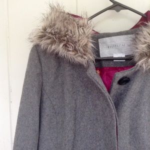 Gray wool coat with fur trim and pink lining.
