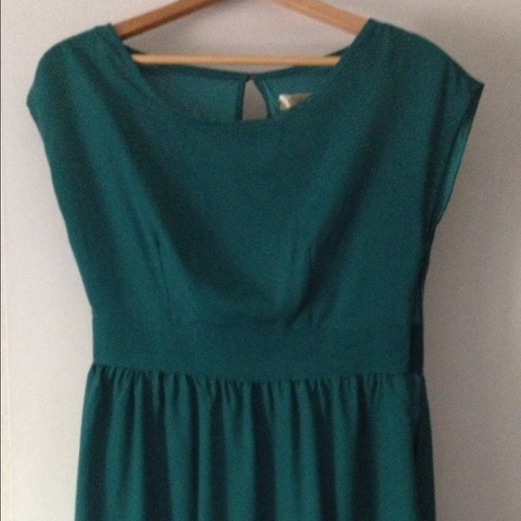 Knee length bubble hem dress with open back.