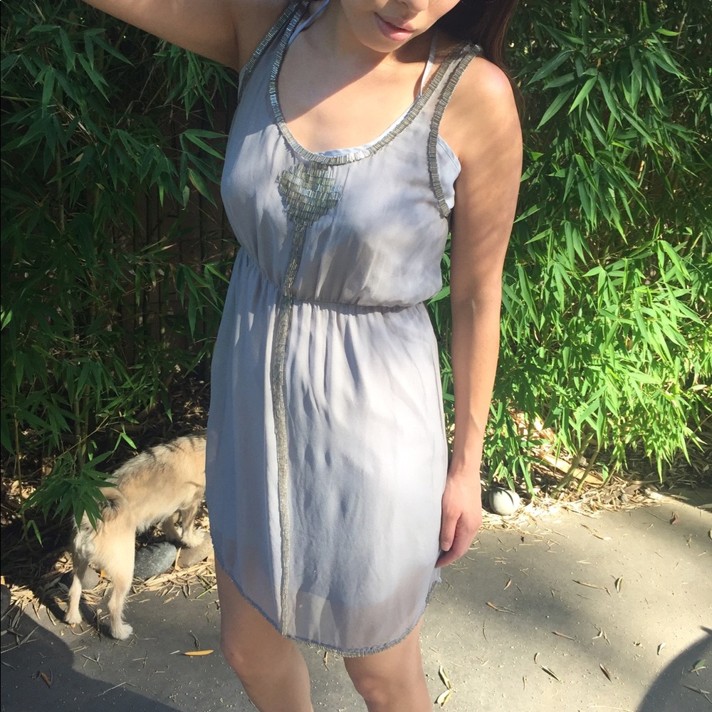 Sleeveless mini dress with metal beading details
