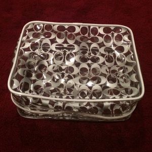Transparent coach make up bag.