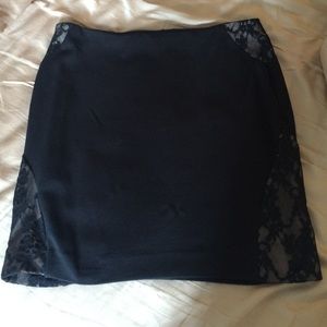 Black mini skirt with lace detail.