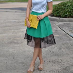 Green midi skirt with black trim. Worn once!