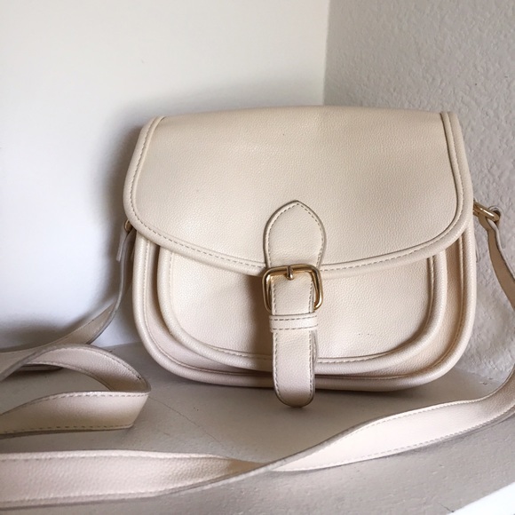 Forever 21 Handbags - Forever 21 Cream crossover bag with gold buckle