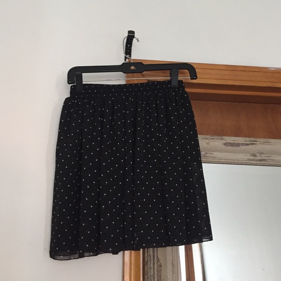Black polka dot skirt.