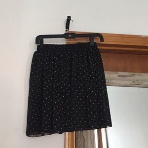 Black polka dot skirt.