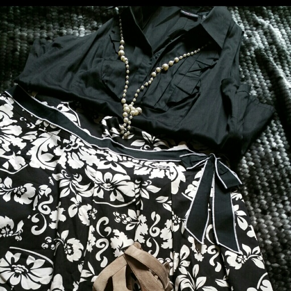 Black and white pleated with bow on skirt.