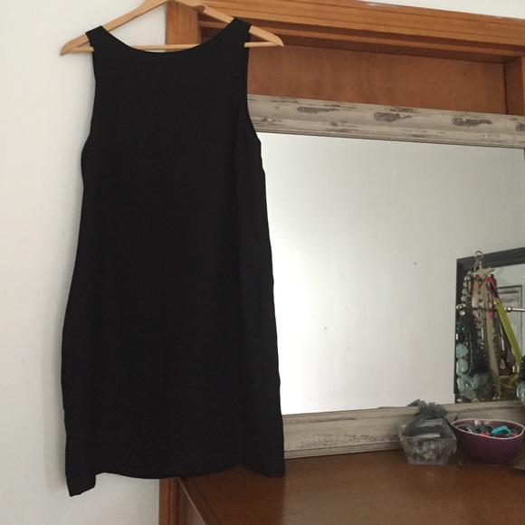 Black shift sleeveless dress.