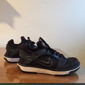 Black Nike sneakers.