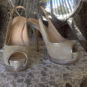 Silver snakeskin peep-toe platforms
