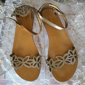 Laser-cut floral detail sandals from Kimchi Blue