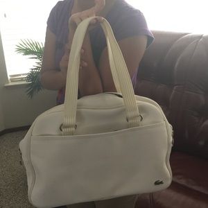 Authentic white Lacoste.