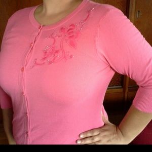 Pink cardigan with design on one shoulder