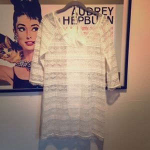 Delicate lace dress with white underlay