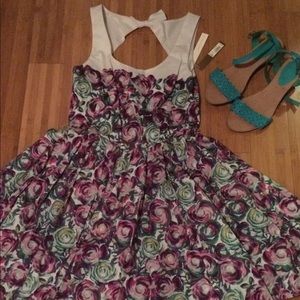 A line floral print w/ back cut out dress. NWT