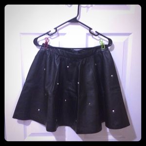 Studded faux leather circle A line skirt.