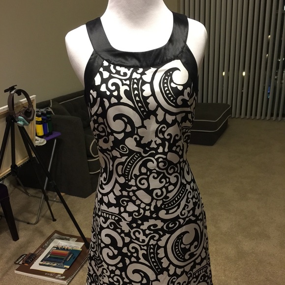 100% silk dress with keyhole detail in the back.