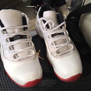 White / varsity red Jordan 11s