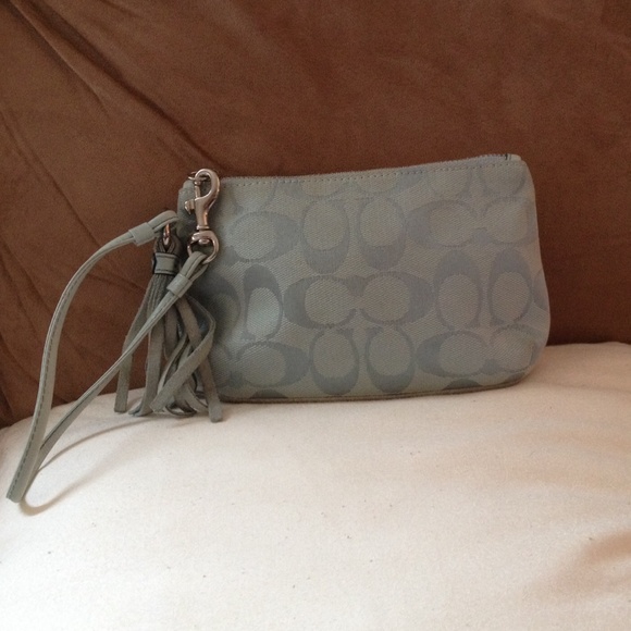 Coach clutch with detachable strap