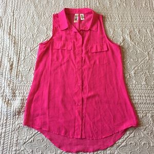 Bright pink sleeveless shirt.