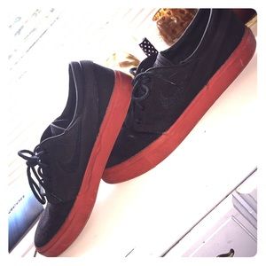 Blacked out Janoskis with red bottoms