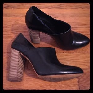 Black leather wood stacked heels.