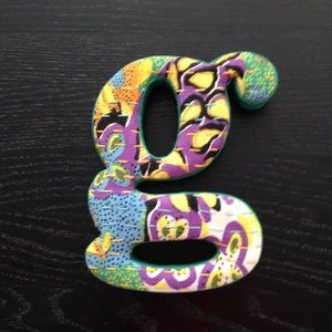 Decorative letter "G"
